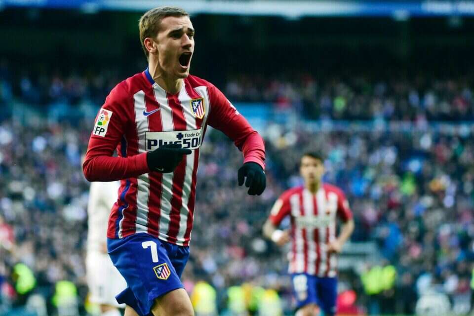 Atletico Madrid's French forward Antoine Griezmann celebrates a goal during the Spanish league football match Real Madrid CF vs Club Atletico de Madrid at the Santiago Bernabeu stadium in Madrid on February 27, 2016. / AFP / PIERRE-PHILIPPE MARCOU , 