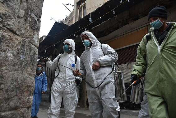 חיטוי רחוב בדמשק // צילום: אי.פי.איי