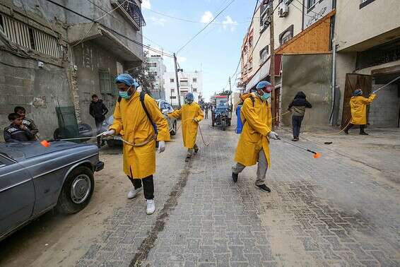 צוות חיטוי בעזה \ צילום: אי.אף.פי