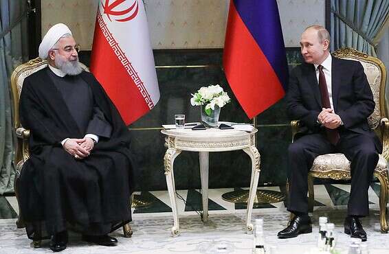 מתאים עמדות? פוטין ורוחאני // צילום: רויטרס