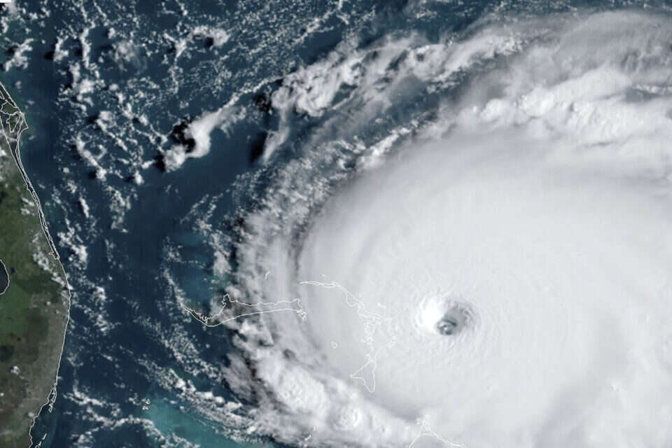 This satellite image obtained from NOAA/RAMMB, shows Tropical Storm Dorian as it approaches the Bahamas and Florida at 13:10 UTC on September 1, 2019. - Hurricane Dorian strengthened into a catastrophic Category 5 storm September 1, 2019, packing 160 mph (267 kph) winds as it was about to slam into the Abaco Islands in the Bahamas, US weather forecasters said. "#Dorian is now a category 5 #hurricane with 160 mph sustained winds," the Miami-based National Hurricane Center said in a tweet."The eyewall of this catastrophic hurricane is about to hit the Abaco Islands with devastating winds," it said. (Photo by HO / NOAA/RAMMB / AFP) / RESTRICTED TO EDITORIAL USE - MANDATORY CREDIT "AFP PHOTO / NOAA/RAMMB/HANDOUT" - NO MARKETING - NO ADVERTISING CAMPAIGNS - DISTRIBUTED AS A SERVICE TO CLIENTS *** Local Caption *** 02.09.19 , 