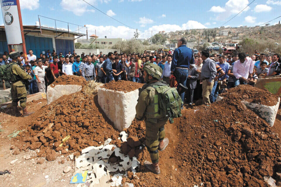 שיפורים מבצעיים בנקודות התורפה. עמדת בידוק של צה"ל סמוך לשכם // צילום: אי.פי.איי // שיפורים מבצעיים בנקודות התורפה. עמדת בידוק של צה"ל סמוך לשכם ,