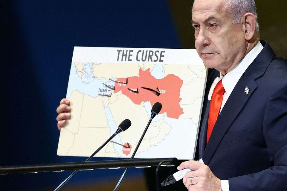 Israeli Prime Minister Benjamin Netanyahu holds a map as he speaks during the General Debate of the United Nations General Assembly at UN headquarters in New York City on September 26, 2025. (Photo by CHARLY TRIBALLEAU / AFP) , AFP