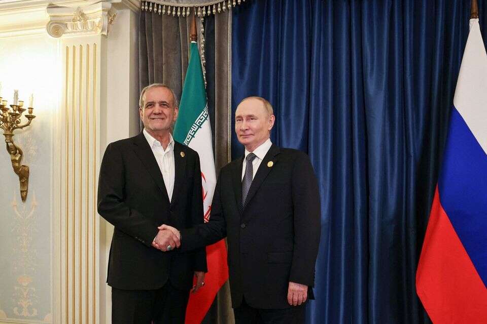 נשיא רוסיה ולדימיר פוטין ונשיא איראן מסעוד פזשכיאן , רויטרס