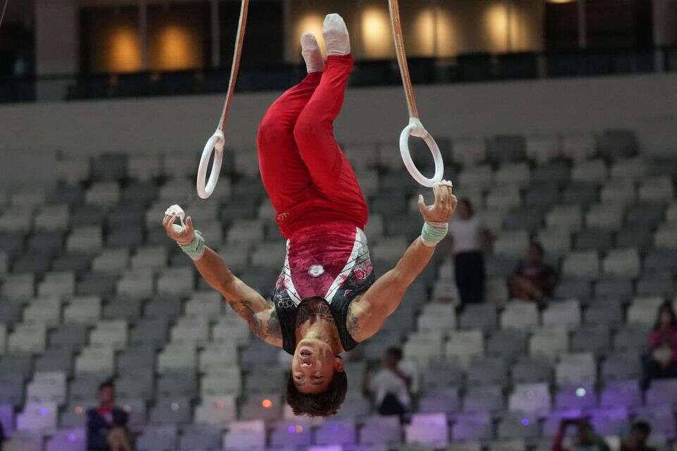 וואנג אסיאנג מתחרה מול יציעים ריקים באינדונזיה , AP