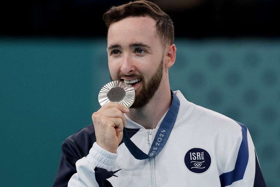 Once and for all: why do athletes bite the medal?