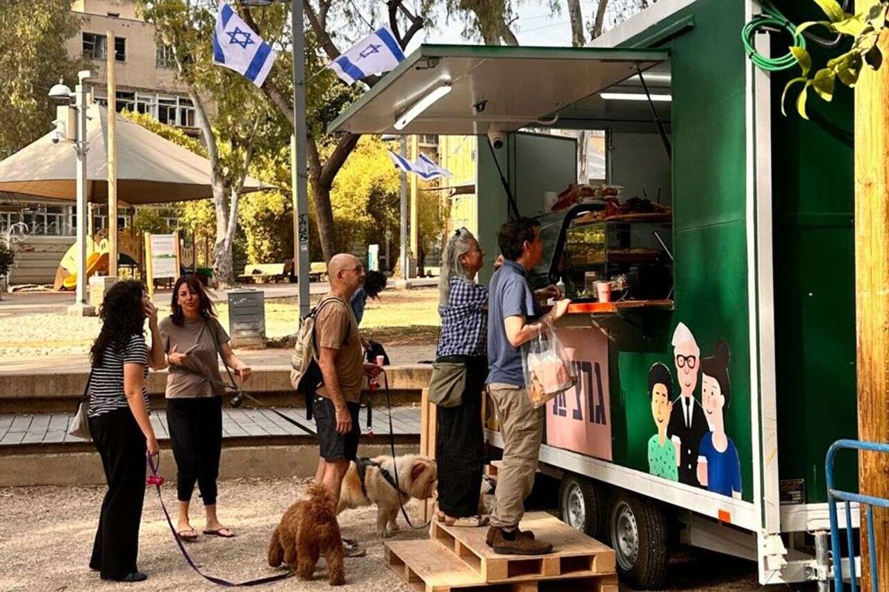The popular cafe that was destroyed by a missile has come back to life as a coffee cart