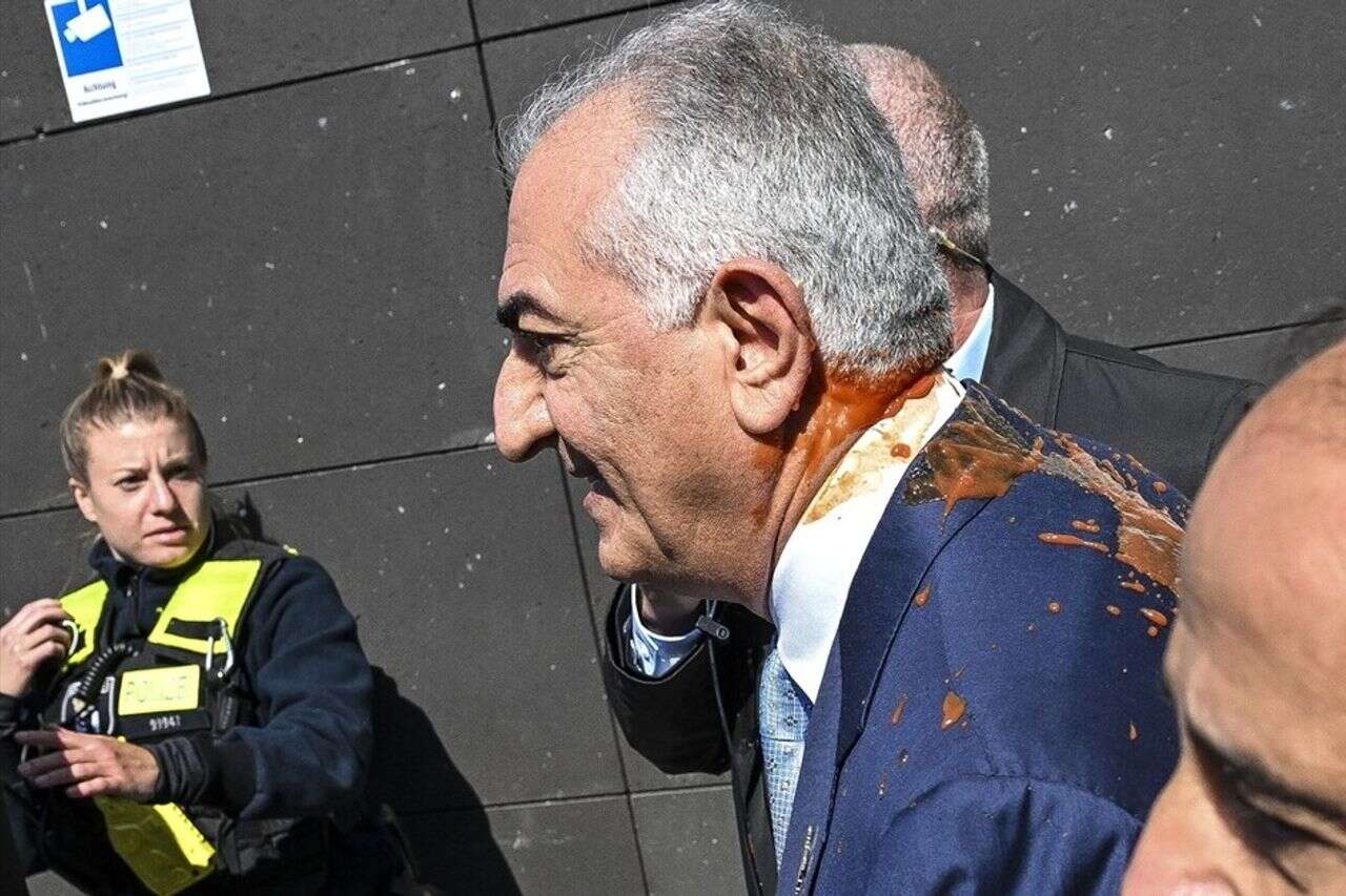 An activist threw paint on the Iranian Crown Prince Reza Pahlavi watch