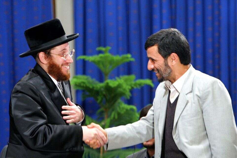 נשיא איראן לשעבר ומשה פרידמן, שעומד מאחורי התלונה שהובילה לפשיטה בבלגיה , AP