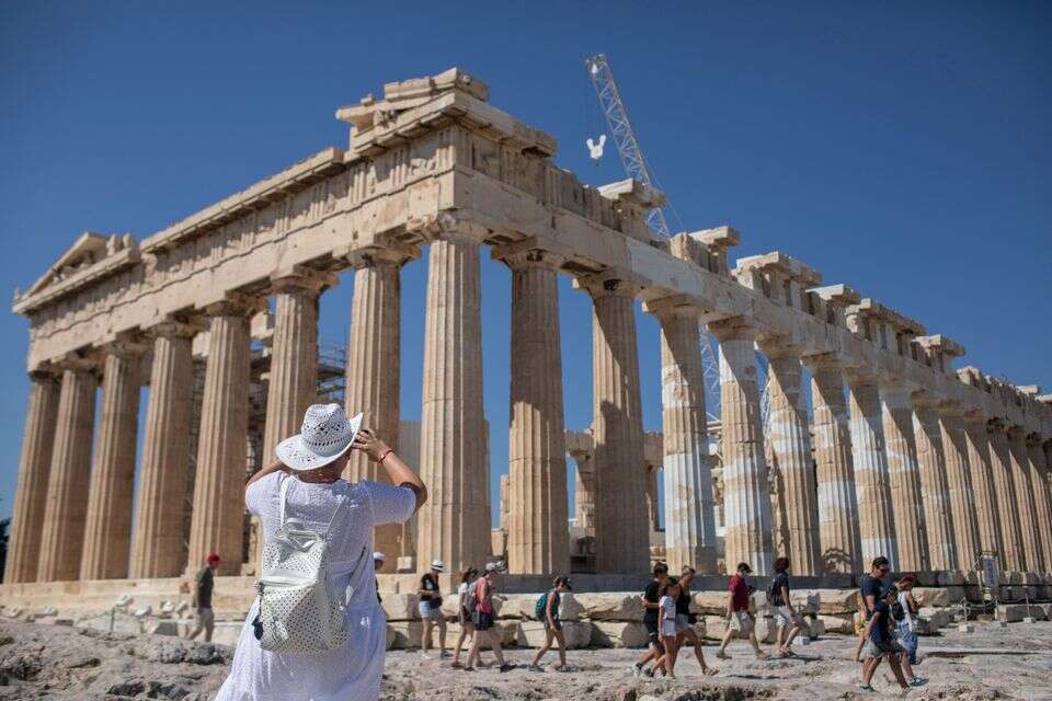 Tourists walk around by Acropolis Hill, in Athens, Friday, July 31, 2020. Greece cautiously reopened its tourism industry, despite tough new coronavirus restrictions that came into force this week. Most of the new restrictions are unrelated to tourism.(AP Photo/Petros Giannakouris) *** Local Caption *** 27.08.20
11.09.20 ?
07.05.21 , AP Photo/Petros Giannakouris