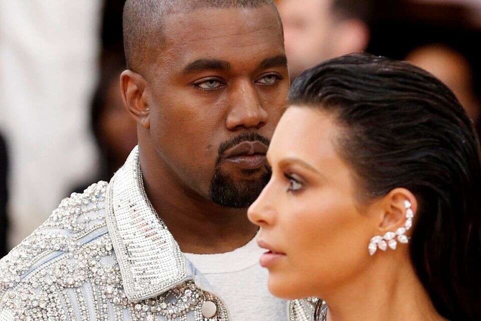 FILE PHOTO - Musician Kanye West (L) and wife Kim Kardashian arrive at the Metropolitan Museum of Art Costume Institute Gala (Met Gala) to celebrate the opening of "Manus x Machina: Fashion in an Age of Technology" in the Manhattan borough of New York, May 2, 2016. REUTERS/Lucas Jackson/File Photo *** Local Caption *** 08.12.16 , REUTERS/Lucas Jackson
