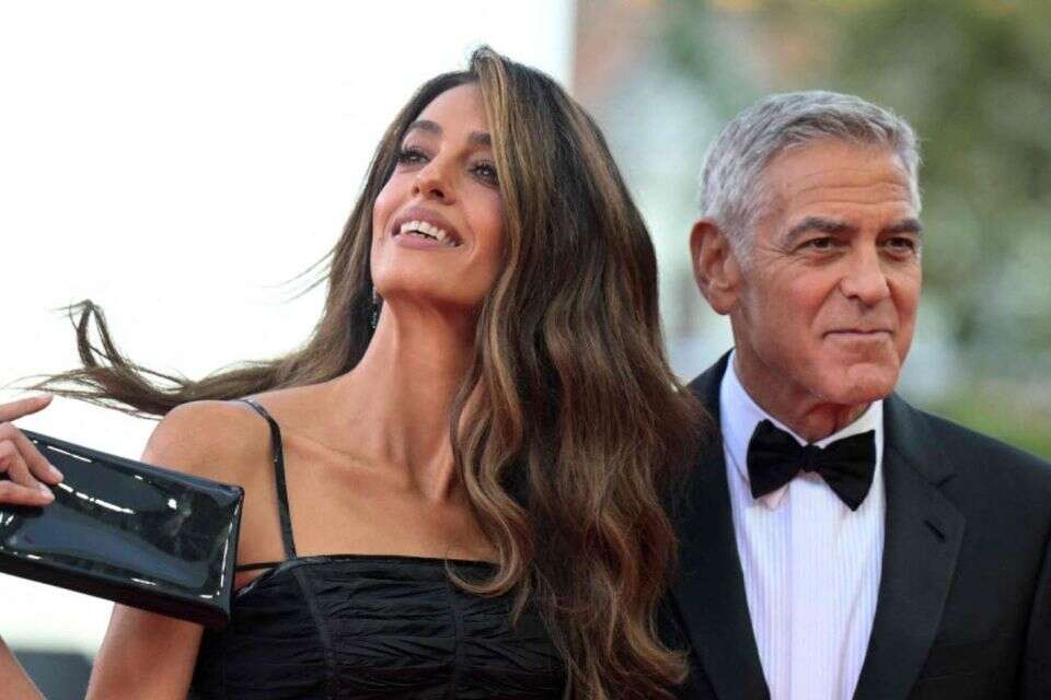 CORRECTION / Lawyer Amal Clooney and US actor George Clooney, attend the red carpet event ahead the screening of Ink and the Opening ceremony of the 83rd International Venice Film Festival, at Venice Lido on September 2, 2026. (Photo by Tiziana FABI / AFP) / The erroneous mention[s] appearing in the metadata of this photo by Tiziana FABI has been modified in AFP systems in the following manner: [Ink] instead of ["Hink"]. Please immediately remove the erroneous mention[s] from all your online services and delete it (them) from your servers. If you have been authorized by AFP to distribute it (them) to third parties, please ensure that the same actions are carried out by them. Failure to promptly comply with these instructions will entail liability on your part for any continued or post notification usage. Therefore we thank you very much for all your attention and prompt action. We are sorry for the inconvenience this notification may cause and remain at your disposal for any further information you may require. , Tiziana FABI / AFP