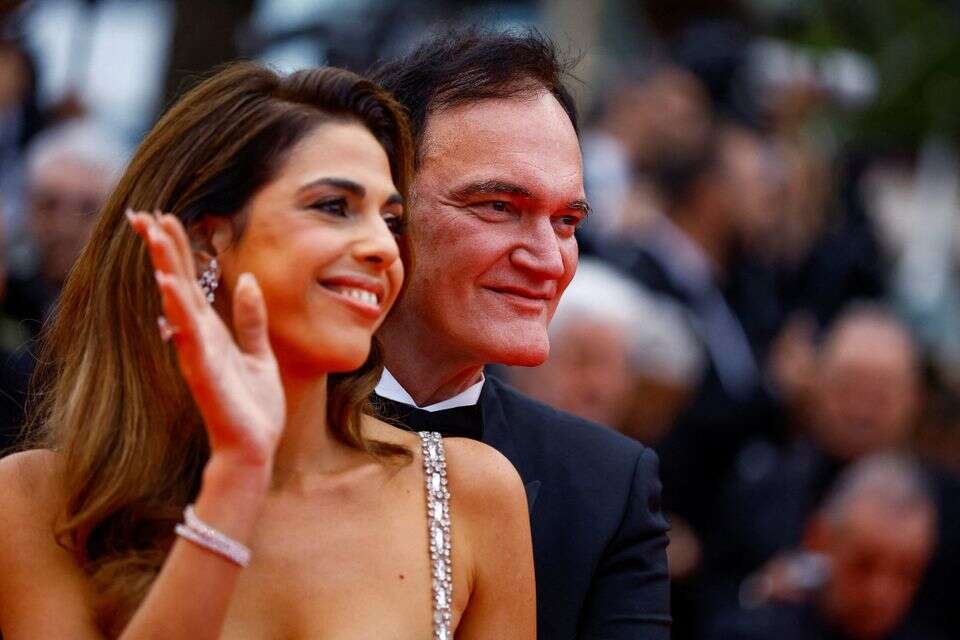 Quentin Tarantino and Daniella Pick pose on the red carpet during arrivals for the opening ceremony and the screening the film "Partir un jour" (Leave One Day) Out of competition at the 78th Cannes Film Festival in Cannes, France, May 13, 2025. REUTERS/Sarah Meyssonnier TPX IMAGES OF THE DAY , REUTERS/Sarah Meyssonnier