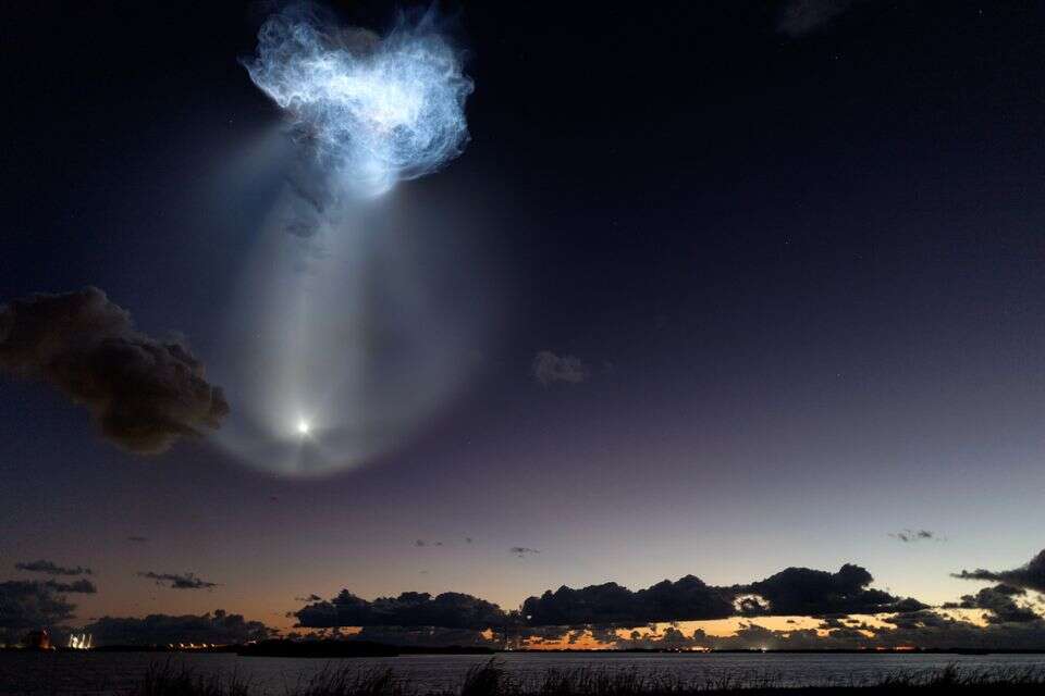 epa13300152 The SpaceX Falcon 9 rocket carrying NASAs CRS-35 mission, creates the distinctive 'space jellyfish' effect as it lifts off from Space Launch Complex 40 over Cape Canaveral Space Force Station, Florida, USA, 13 October 2026. The rockets exhaust plume expands at high altitude and is illuminated by sunlight while the launch site remains in darkness, creating the 'space jellyfish' effect. According to NASA, the mission delivers more than 6,300 pounds of science investigations, supplies, and equipment to the International Space Station, including the final set of Roll-Out Solar Arrays, research materials for artificial retina manufacturing, and 3D heart tissue models to advance scientific research in microgravity. EPA/CRISTOBAL HERRERA-ULASHKEVICH , EPA/CRISTOBAL HERRERA-ULASHKEVICH